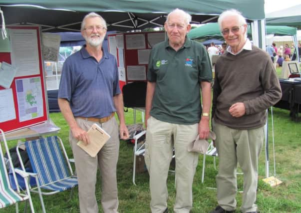 John Hartley (left) with Tony Birch, Planning Officer and Cedric Hoptroff, Vice President, at the Canal Festival in 2012