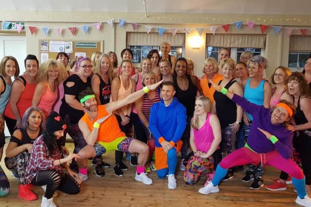 Take That join in with the Zumba routine. Lucy is pictured second from left (standing row)