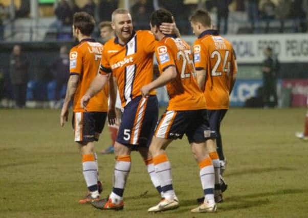 Steve McNulty and Ronnie Henry share a joke against Lincoln