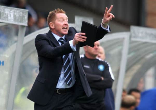 Wycombe boss Gary Waddock in touchline action