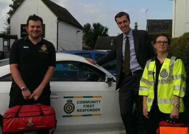 MP Andrew Selous with Community First Responders Stephen Bennett and Donna Young     MPLO