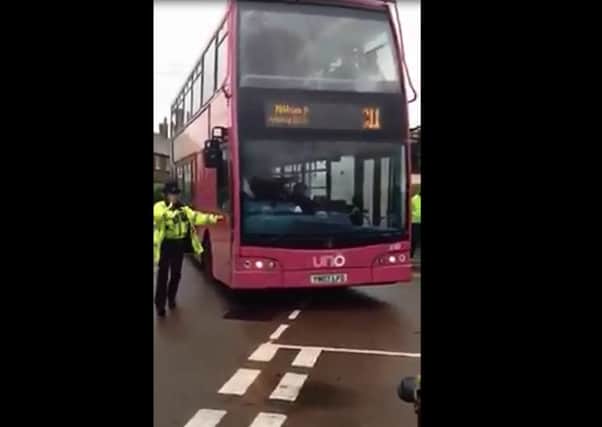 Bus driver angers crowd after interrupting Remembrance service VIDEO: JAMES VINCENT FACEBOOK