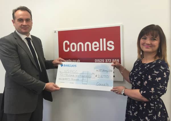 Connells Estate Agency chief executive David Plumtree presents cheque to NSPCC
