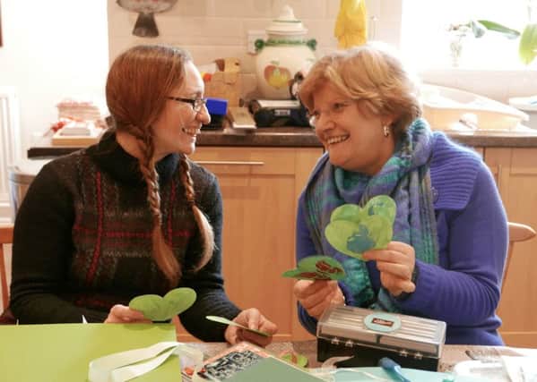 Cheddington WI - Secretary Lorraine Firmin and President Irene Johnston  are helping raise awareness of climate change