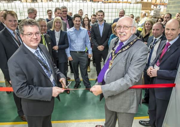 Dave Williams, President of the Peli BioThermal Division cutting the ribbon alongside the Mayor of Leighton-Linslade, councillor Ray Berry