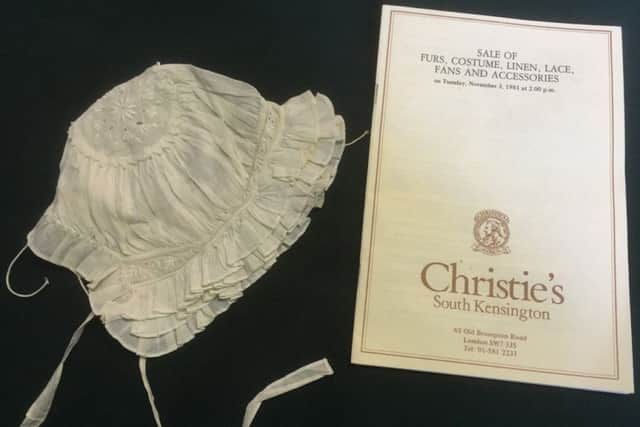 Christies 1981 catalogue with the child's bonnet