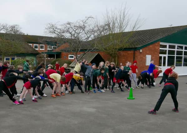Cheddington Combined School warm up for Sports Relief run. Picture: Deborah M. Hodgetts.