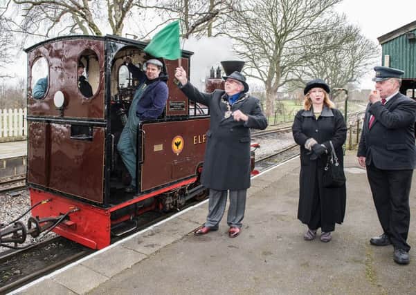 Mayor Ray Berry waves the green flag to driver Steve Warren, watched by Val Berry and volunteer Peter Patmore, at Leighton Buzzard Narrow Gauge Railway
