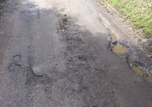 The potholes left on Stoke Lane