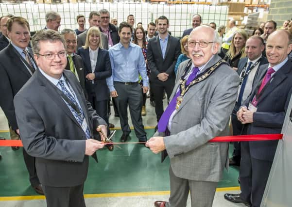 Dave Williams, president of the Peli BioThermal Division cutting the ribbon at the new service centre with Mayor of Leighton-Linslade, Cllr Ray Berry.