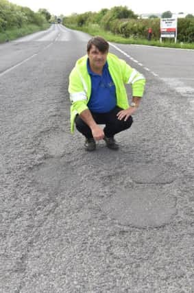 Ian Haybittle with some of the road repairs by his business