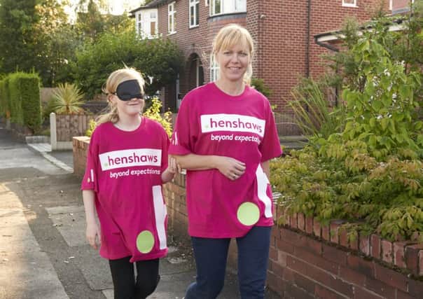 Eleven-year-old visually impaired Alicia Wright who will be doing a charity challenge blindfold, accompanied ne her mum Lisa
