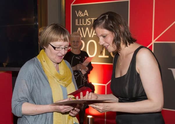 Kate Milner receives her award from Rafi Romaya, art director at Canongate Books.