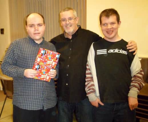 Paul Bowen-James (centre) with two of the charity's original members, Ben (left) and Matt (right)