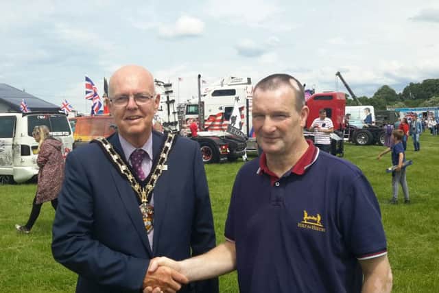 Leighton Linslade Town Mayor, Councillor Steve Cotter, welcomes Mr Phil Rigby, father of Fusilier Lee Rigby, after the Help for Heroes Truck Convoy's arrival at the showground