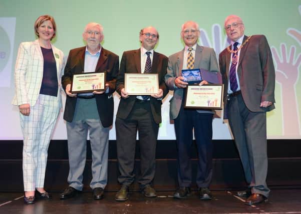 Leighton Buzzard businessman Graham Mountford (centre) who was highly commended in the Volunteer Section of the Cheering Volunteering Awards