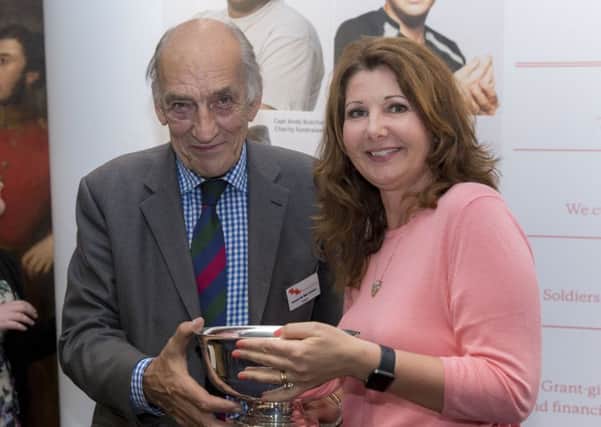 General Sir Mike Jackson presenting the Montgomery Bowl to Stanbridge fundraiser Jacqui Sage-Passant