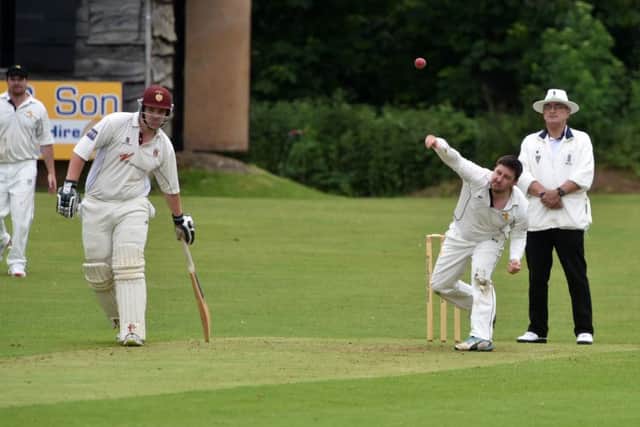 Leighton's Anthony Francis bowling against Great Brickhill