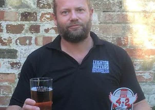 Jon dEste-Hoare with his new brew 4-2