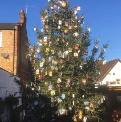 Beer mats cover the Christmas tree at the Black Lion.  Photo: John Trotman