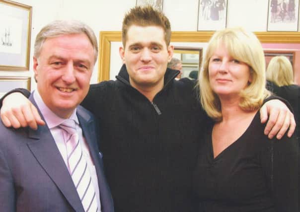 Top tailors Geoff and Laura Souster with Michale Buble