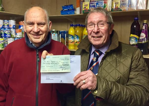 Douglas Deards of the Need Project (left) with Freemasons' representative John Cater presenting a cheque