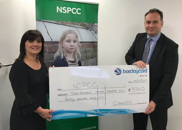 Connells chief executive David Plumtree presents a cheque for Â£3,340 to Jacqui Venters of the NSPCC
