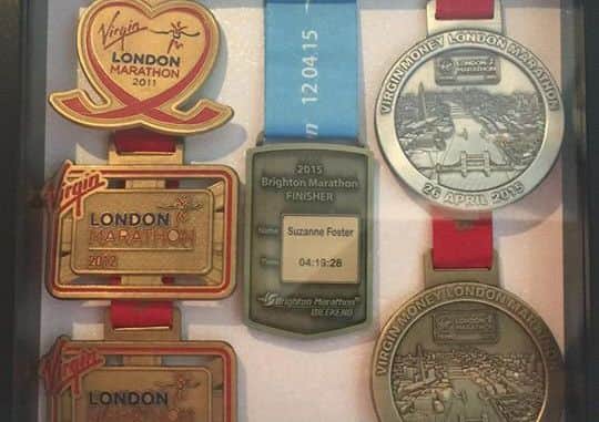 Just a few of Suzie's marathon medals!