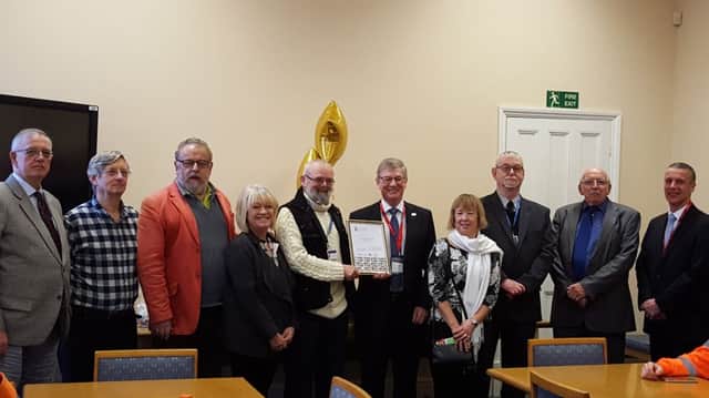 Councillors K Ferguson, C Palmer, T Morris, C Chambers, S Jones, C Perham, J M Freeman and R Berry along with the Interim Chief Executive of the Society of Local Council Clerks, Richard Walden, and the incoming permanent Chief Executive of the SLCC, Rob Smith.  Staff were also present to join in the celebration of achieving the award.