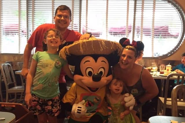 Ella and family at Disneyworld last August to celebrate her operation anniversary