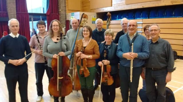 Katharine Reedy (front row, 3rd from left), Trustee of Citizens Advice Leighton-Linslade, with fellow musicians who will be performing in the Gala Orchestra.