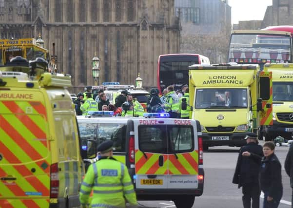 Emergency personnel on Westminster Bridge, close to the Palace of Westminster, London,  Photo: Lauren Hurley/PA Wire