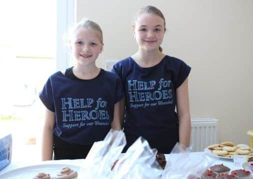 Leighton sisters Olivia (left) and Amelia Shipley  who raised Â£509 for Help for Heroes with a cake sale