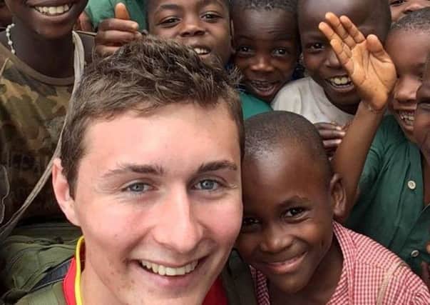 Leighton teenager Michael Carter with some of the orphans he befriended in Malawi