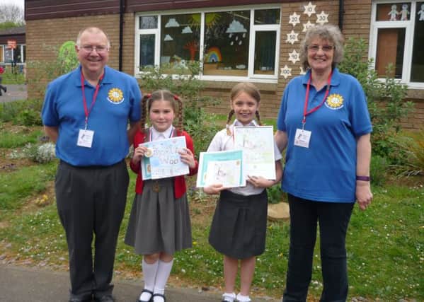 Leighton-Linslade in Bloom competition winners Isla (second left) and Remi with organisers David Rosie and Rosie Palmer