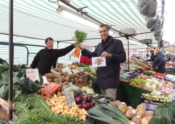 South West Beds parliamentary candidate Andrew Selous buying veg