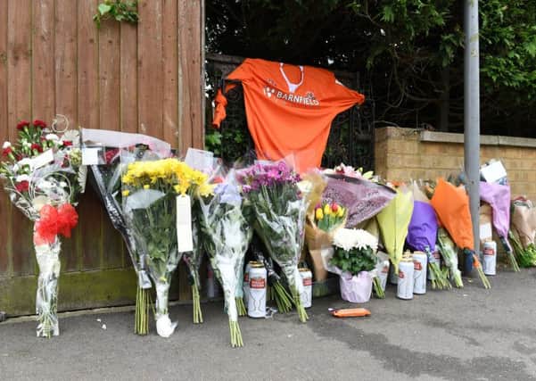 Tributes have been left at the scene of Saturday's fatal collision on Southcourt Avenue. Photo by Jane Russell