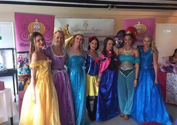 Rachel (left) poses with other Disney princesses