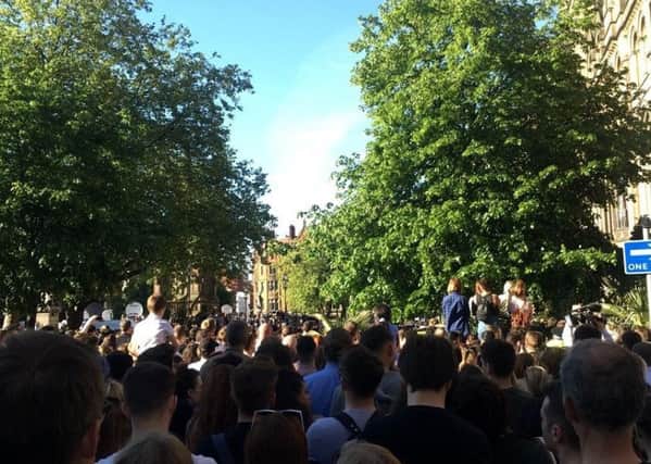 Crowds gather at Manchester's Albert Square
