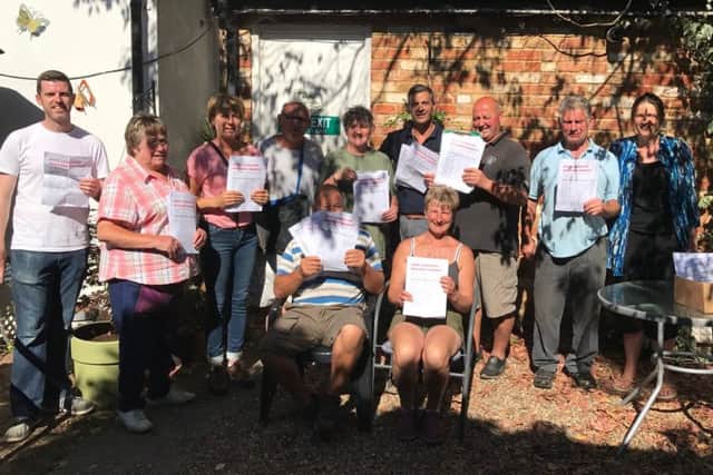 Leighton Buzzard Market Supporters (LBMS) with their petition calling for the town council to rethink plans to put all stalls on one side of the High Street