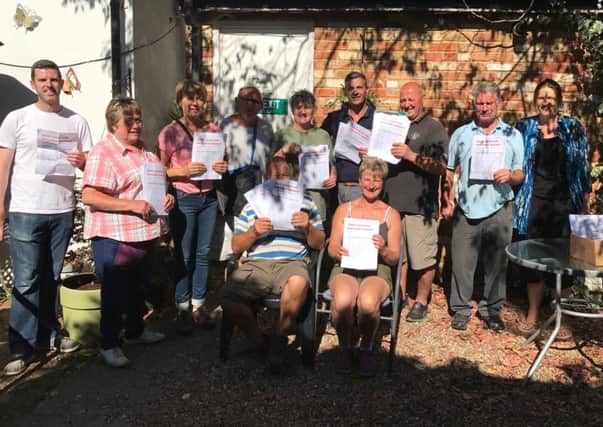 Leighton Buzzard Market Supporters (LBMS) with their petition calling for the town council to rethink plans to put all stalls on one side of the High Street