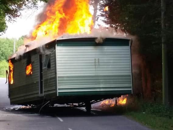 The caravan ablaze. Photo: David Heslop