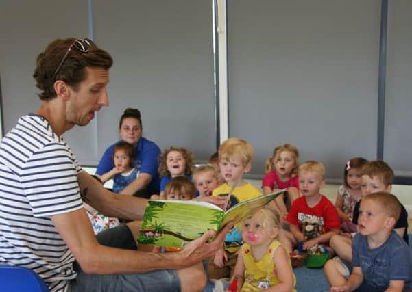 Oliver Jackson visited Mentmore Road Under Fives Preschool to read stories to the children