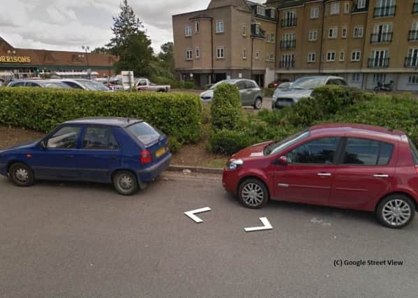 Cars parked on double yellow lines. Photo by Google Street View