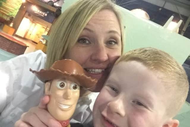 Ellis, Suzanne, and Woody. Ellis has watched Toy Story around one hundred times!