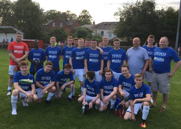 Staff from Tesco took on Morrisons in a charity football match to raise money for KidsOut