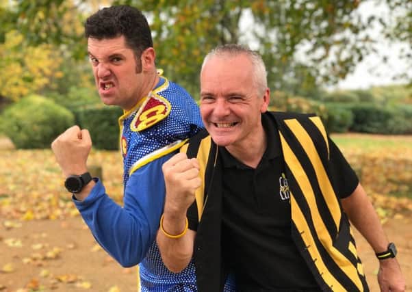 Colonel Custard (right) and Captain Calamity are aiming to break the pie-flinging world record at London's ExCel Centre
